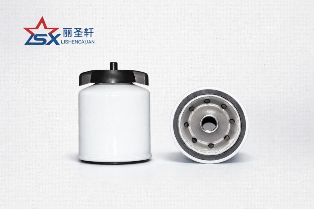 Close-up of LSX fuel water separator filter base and threaded connection on light gray background