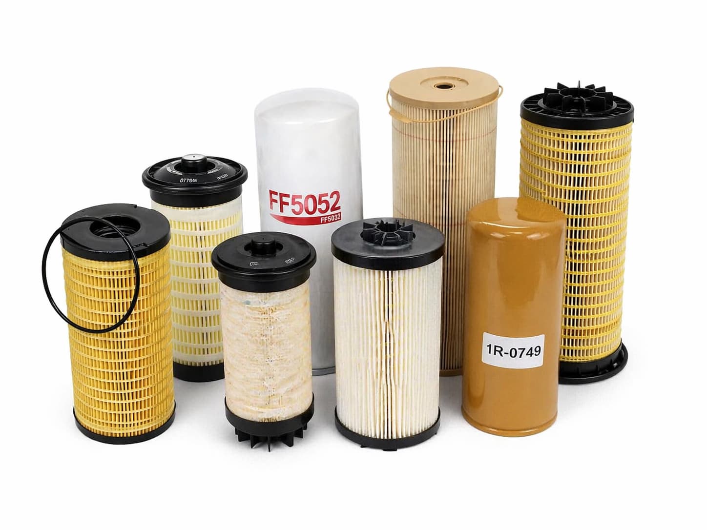 Grouped diesel fuel filters on white background for wholesale and aftermarket supply