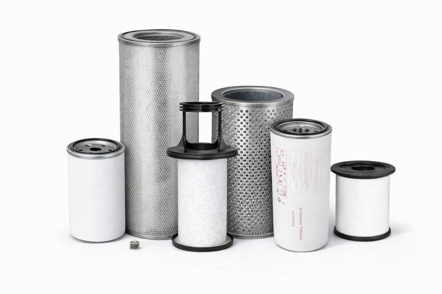 Industrial oil air separator elements grouped together on white background
