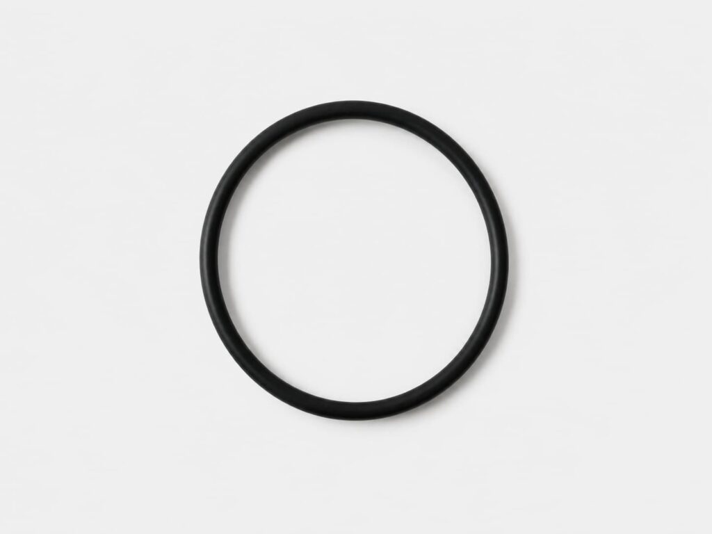 Black rubber seal ring for industrial filter element gasket and sealing material selection.