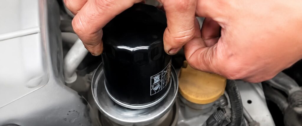 Engine oil filter replacement during vehicle maintenance