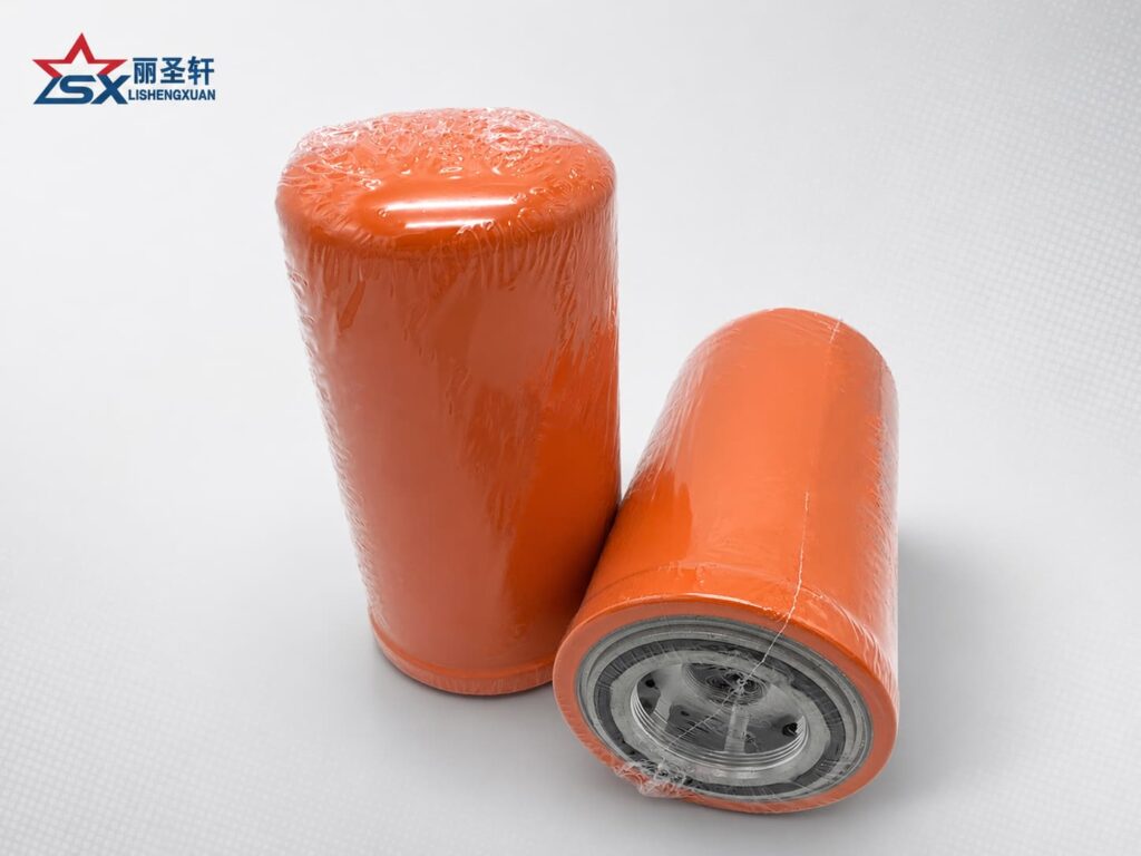 Orange spin-on oil filter showing threaded mounting base and filter structure for aftermarket supply